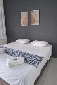 two beds sitting next to each other in a bedroom at Modelo Prime Hotel in Ribas do Rio Pardo