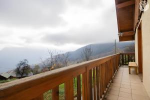a wooden balcony with a view of a mountain at La Gelinotte - Jarrier in Jarrier