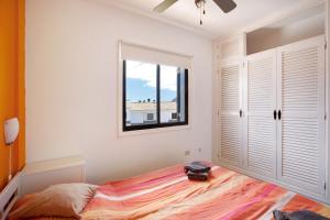 a bedroom with a bed and a window at Casa Dos Ángeles in Arona +17 photos