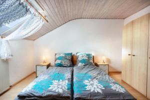a bedroom with a bed and two night stands at Ferienwohnung Fly in Wehr