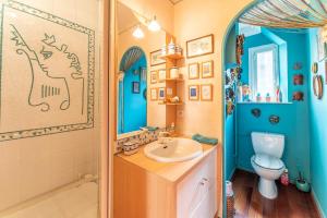 a bathroom with a sink and a toilet at Appart face au Palais des Papes in Avignon