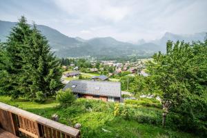 a view of a town with mountains in the background at Chalet la Bartavelle - Morillon in Morillon
