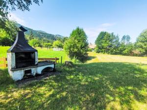 an old stove in the middle of a field at Apartment Chalet Altavista by Interhome in Ziano di Fiemme +48 photos