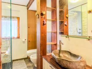a bathroom with a sink and a toilet at Apartment Chalet Altavista by Interhome in Ziano di Fiemme