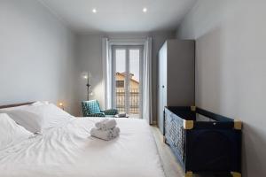 a bedroom with a bed with a stuffed animal on it at Puntodivista in Loano