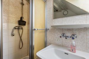 a bathroom with a sink and a shower at Storchennest in Ludwigsburg +11 photos