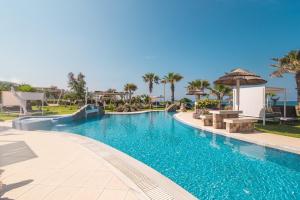a swimming pool at a resort with a clear blue at Mirage Arillas Studio Type B14 in Arillas