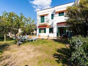 a house with a yard in front of it at Apartment Marisol by Interhome in Toirano