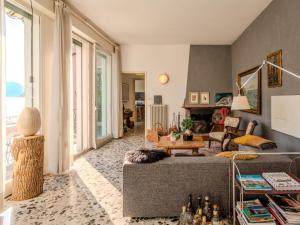 a living room with a couch and a table at Villa Casa Silvana by Interhome in Valsolda +50 photos