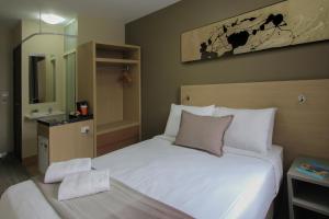 Postel nebo postele na pokoji v ubytování ibis Budget - Melbourne CBD