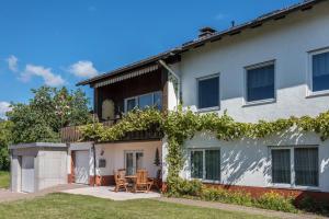 a house with two chairs and a table at Haus Isele in Urberg