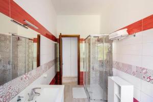a bathroom with a shower and a sink at Villa Lucia Guesthouse Minturno in Minturno +25 photos