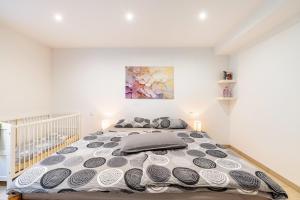 a bedroom with a large bed in a room at Eifel im Herzen in Hambuch