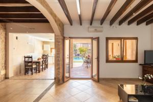 an open living room with a kitchen and dining room at Casa Magui in Capdepera