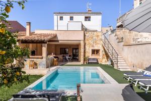 a pool in the backyard of a house at Casa Magui in Capdepera