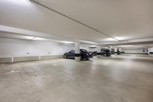 an empty parking garage with cars parked in it at Ferienwohnung Moin am Meer in Scharbeutz