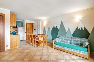 a living room with a couch and a table at Residence Larice Bianco App n2 in Campodolcino