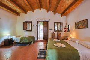 a bedroom with two beds in a room at Ospitalità D'alunzio in San Marco dʼAlunzio