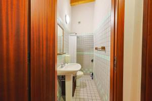 a bathroom with a sink and a toilet at Ospitalità D'alunzio in San Marco dʼAlunzio +67 photos