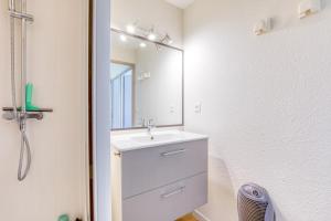 a bathroom with a sink and a mirror at Le Mas de la Mer in Frontignan +17 photos