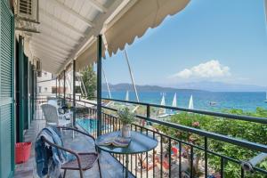 a balcony with a view of the ocean and sailboats at S7 apartment in Nikiana