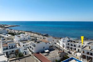 an aerial view of a city and the ocean at Affittacamere Arcobaleno in Torre San Giovanni Ugento