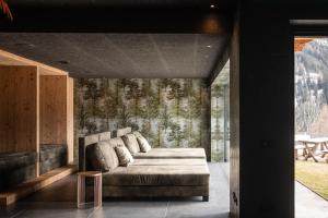 a living room with a couch in a room at Bruneggerhof Weissenbach in Rio Bianco