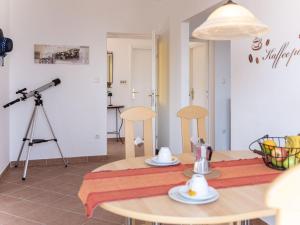 a room with a tripod and a table with a camera at Holiday Home Orbani by Interhome in Lovran