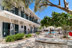 a resort with a swimming pool and a building at Nikiana Club - Studio 2 in Nikiana