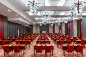 a large room with tables and red chairs at Sile Gonen Hotel in Şile +57 photos