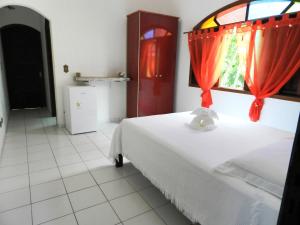Cama ou camas em um quarto em Praia Canto do Forte Guest House