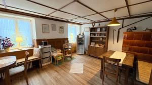 a living room with a table and a dining room at Ferienwohnung Hofidylle in Münstertal
