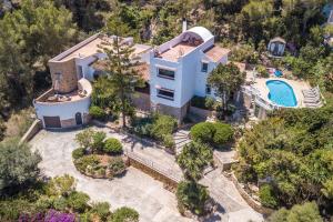 an aerial view of a house with a swimming pool at Shangri-la in Santa Eularia des Riu