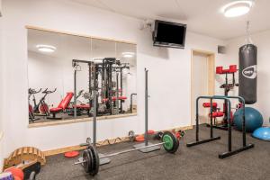 a gym with several different kinds of exercise equipment at Apartment Cater Residence Bun Ste in San Vigilio Di Marebbe