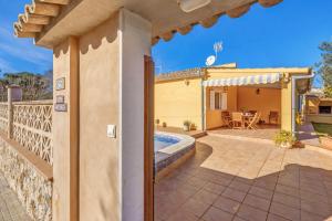 an external view of a villa with a swimming pool at Can Parets in Santanyi