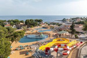 an amusement park with a pool and water slide at Camping Lou Soulei 218 in Carry-le-Rouet