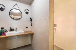 a bathroom with a sink and a mirror at Luisalle Top 5 in Auffach +21 photos