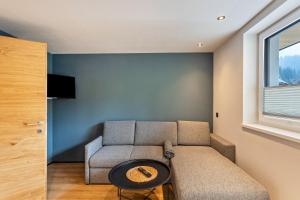 a living room with a couch and a table at Luisalle Top 5 in Auffach