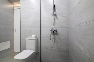 a bathroom with a shower with a toilet in it at Casa Anzol in Fuzeta +34 photos