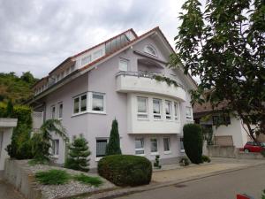 a white house with a lot of windows at Haus Am Weinberg 2 in Endingen