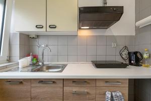 a kitchen with a sink and a stove at 2 Bett Apartment a d A8 - W5 in Beckingen +12 photos