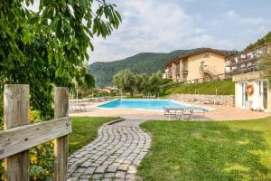 a villa with a swimming pool in a resort at Nonna Gina in Tignale