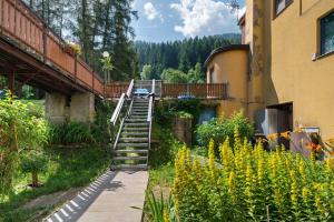 a stairway leading up to a building with a ladder at Marilleva 900 Terminal in Mezzana