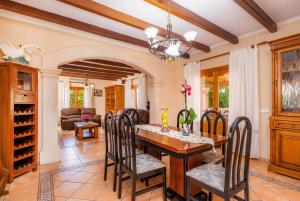 a dining room with a table and chairs at Can Lopez Vara in Campos