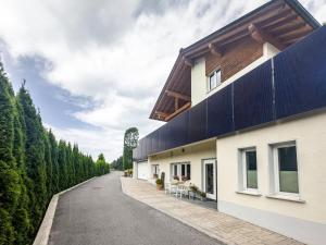 a house with blue panels on the side of a road at Apartment Wesseling in Fontanella