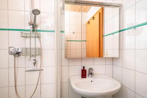 a bathroom with a shower and a sink at Apartment Wesseling in Fontanella +19 photos