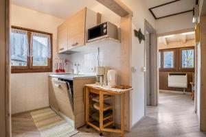 a small kitchen with a sink and a counter at Casa Camilla in Ledro