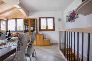 a kitchen and dining room with a table and chairs at Casa Camilla in Ledro +16 photos