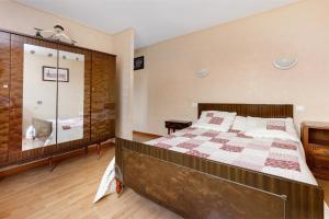 a bedroom with a bed and a glass shower at Chambre d'hôtes à Saint-Molf in Saint-Molf