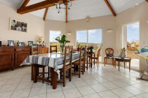 a large dining room with a table and chairs at Chambre d'hôtes à Saint-Molf in Saint-Molf +12 photos